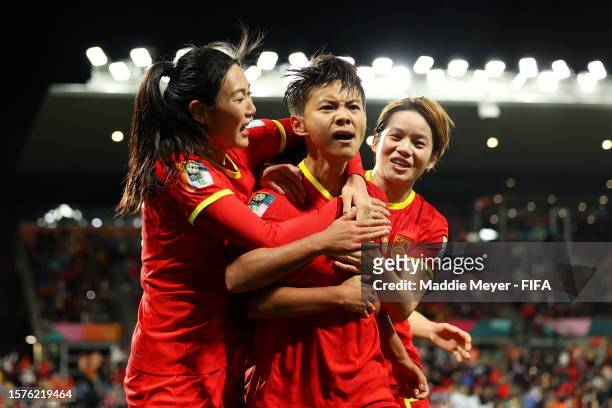 Wang Shuang of China PR celebrates with teammates Yang Lina and Zhang Xin after scoring her team's first goal during the FIFA Women's World Cup...