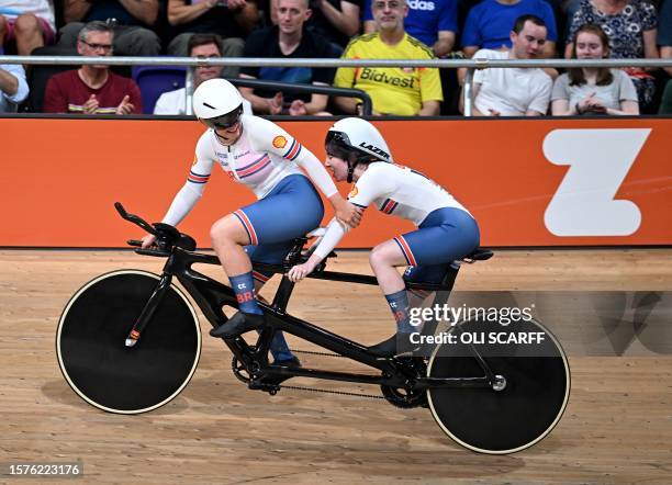 Great Britain's Sophie Unwin and pilot Jenny Holl celebrate winning the gold medal in the women's B para-cycling Individual Pursuit Final at the Sir...