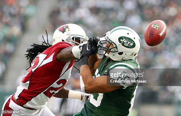 Greg Toler of the Arizona Cardinals breaks up a pass intended for Chaz Schilens of the New York Jets at MetLife Stadium on December 2, 2012 in East...