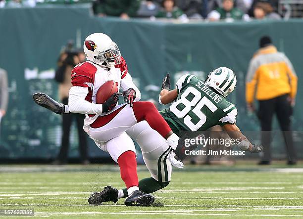 Patrick Peterson of the Arizona Cardinals intercepts a pass intended for Chaz Schilens of the New York Jets at MetLife Stadium on December 2, 2012 in...