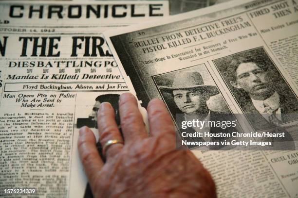 Alvin Freeman, 82-year-old, the grandson of houston police officer, Det. Joseph Robert Free, looks over newspaper articles published on Oct. 14, 1912...