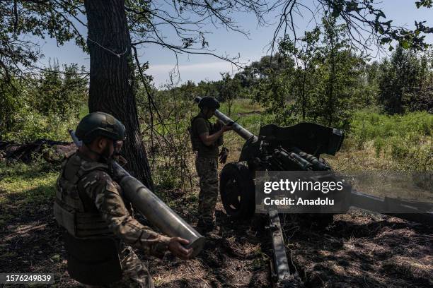 Ukrainian soldiers prepare to open fire on Russian positions in the direction of Bakhmut as Ukrainian Army conduct operation to target trenches of...