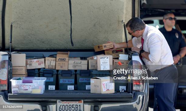 Anaheim Hills, CA Investigators load boxes of ammunition they removed from the home of Orange County Superior Court Judge Jeffrey Ferguson, who was...