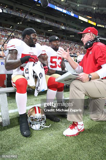 Linebackers Coach Jim Leavitt of the San Francisco 49ers talks with Patrick Willis and NaVorro Bowman during the game against the St. Louis Rams at...