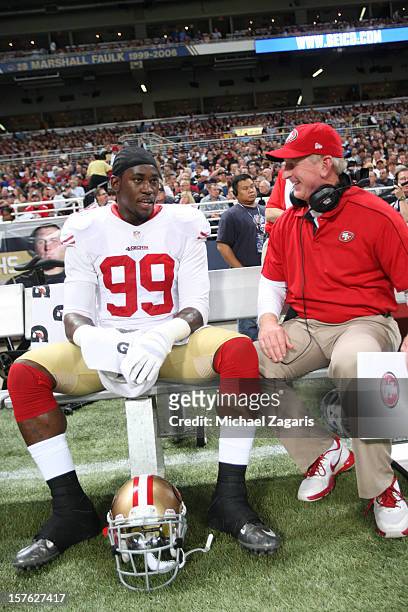 Linebackers Coach Jim Leavitt of the San Francisco 49ers talks with Aldon Smith during the game against the St. Louis Rams at the Edward Jones Dome...
