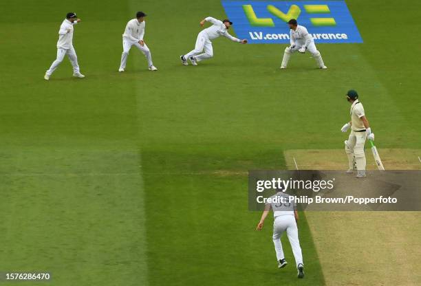 Joe Root of England catches Marnus Labuschagne of Australia off the bowling of Mark Wood during the second day of the 5th Test between England and...