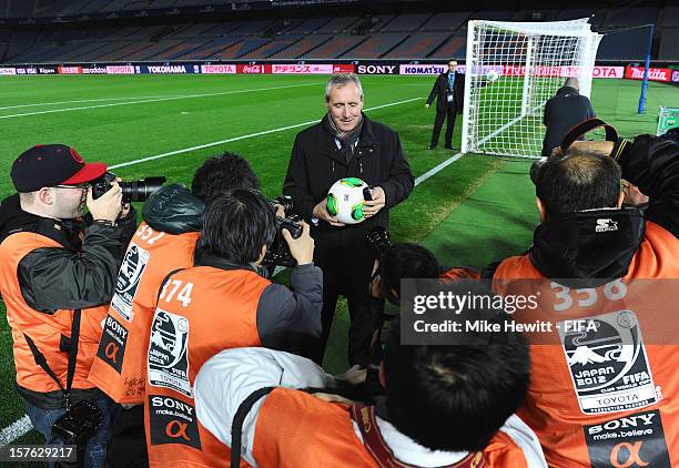 GoalRef Sports Technology Programme Manager Ingmar Bretz and Operations Manager Thomas Pellkofer show their system to Japanese photographers during...