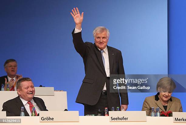Horst Seehofer, Chairman of the Christian Social Union , the Bavarian sister party of the German Christian Democratic Union , waves to delegates...