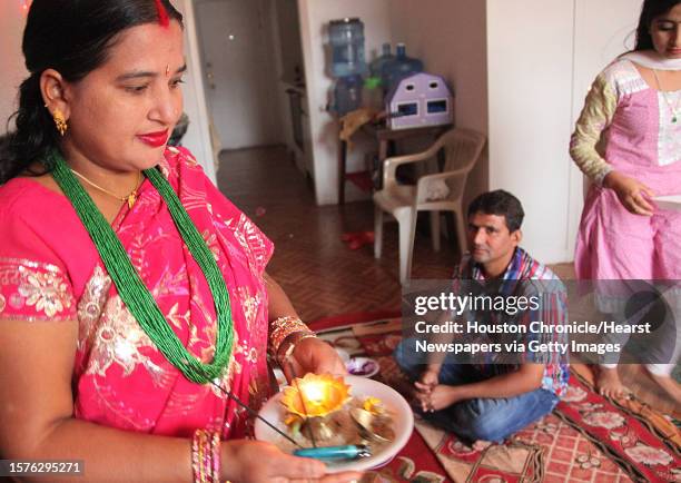 Lachi Kheral walks around in a circle with a candle light to protect her brother Pashu Pati Dhaurali inside circle during the Bhai Tika as Kheral...