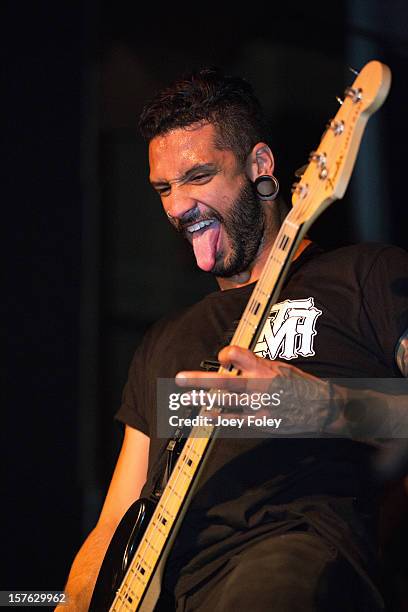 Bassist Aaron Evans of the metalcore band Like Moths to Flames performs at The Irving Theater on December 4, 2012 in Indianapolis, Indiana.