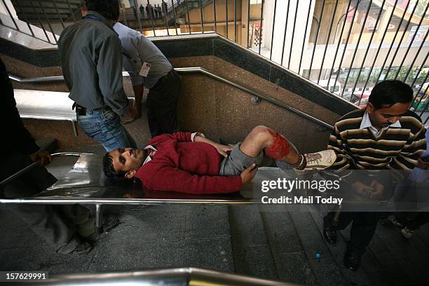 Volunteer acting as bomb blast victims wait for rescue operation during a mock security drill as part of Delhi Emergency Management Exercise in New...