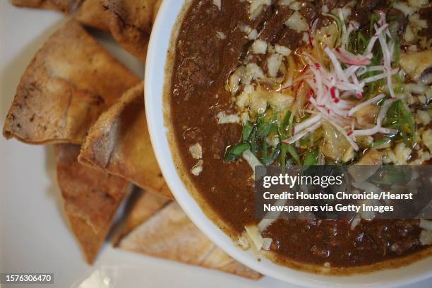 'Haig's Chili' has ground chuck steak with onions, roasted peppers, fava beans, chick peas topped with sharp white cheddar cheese, red radish,...