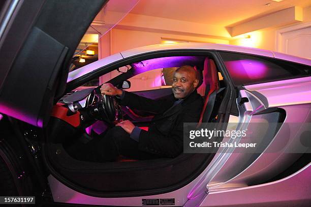 Tony Lindsay test drives a Mclaren at the Victoria Secret Cocktail Viewing Party And Fundraiser For Hurricane Relief Fund at on December 4, 2012 in...