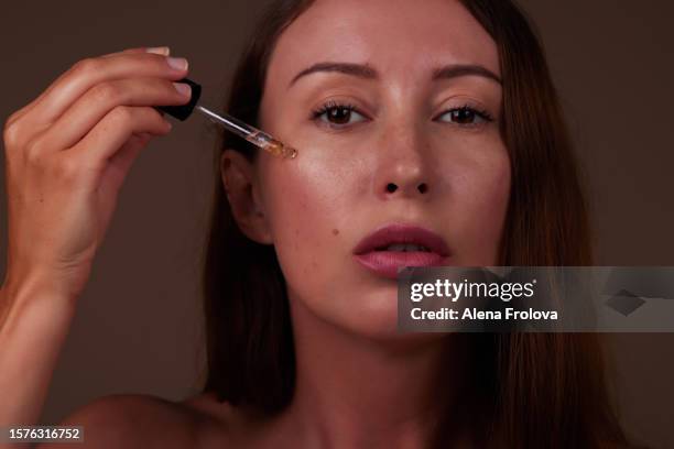 beautiful woman getting skin anti aging treatment - hyperpigmentation stockfoto's en -beelden