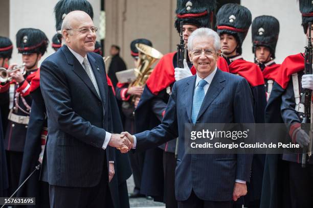 Lebanese Prime Minister Najb Mikati shakes hand with Italian Prime Minister Mario Monti prior a meeting at Palazzo Chigi on December 5, 2012 in Rome,...