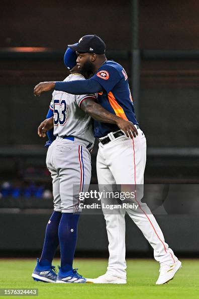 Marcus Semien of the Texas Rangers embraces Yordan Alvarez of the ...