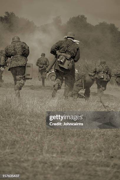 military running in sepia tones - ww2 soldier stock pictures, royalty-free photos & images