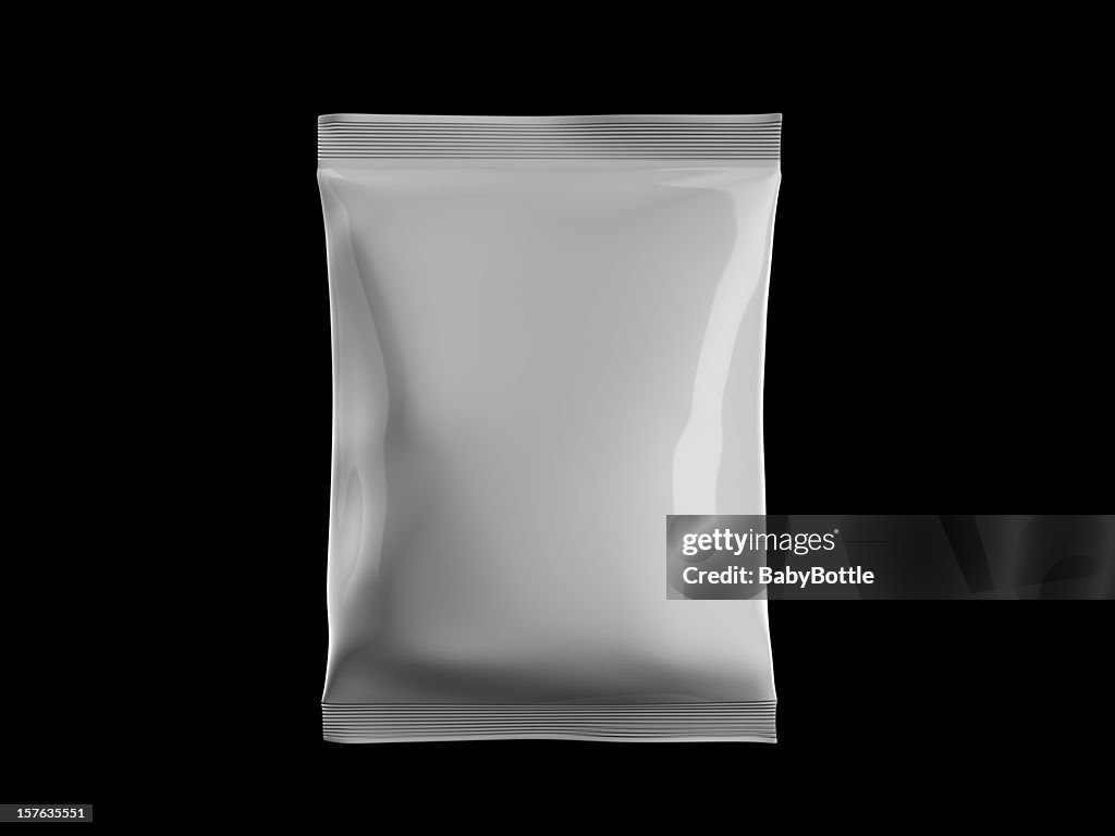 White sealed bag of candy on black background