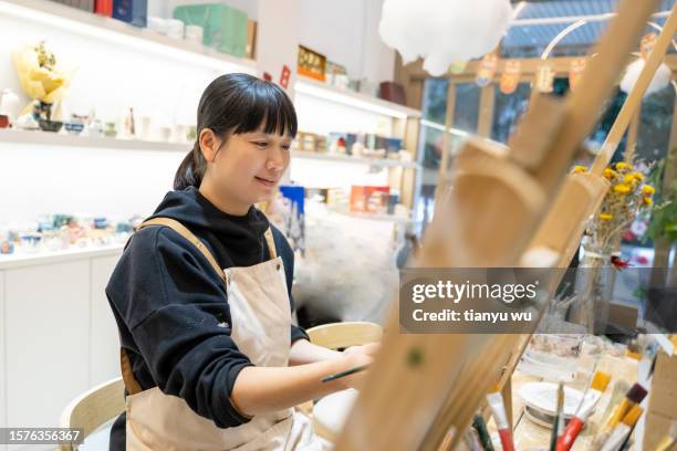 a woman is drawing in the studio - east asian works of art specialist stock pictures, royalty-free photos & images