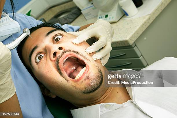 dentist nightmare - dentist's chair stock pictures, royalty-free photos & images