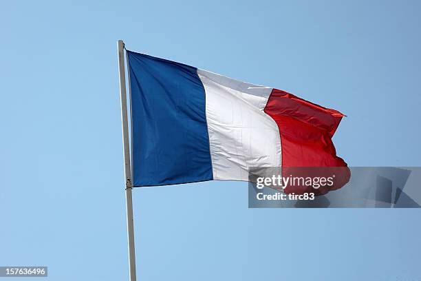 french flag in a blue sky - tricolor stock pictures, royalty-free photos & images