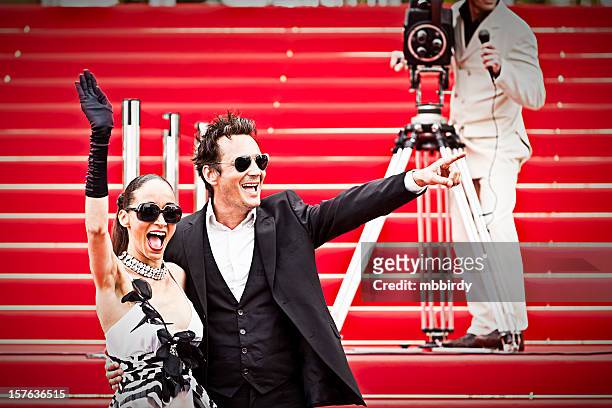 celebrity couple on red carpet in cannes - filmpremière stockfoto's en -beelden