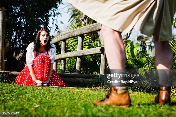 pretty girl gapes, shocked, as flasher exposes himself in park - female flasher stock pictures, royalty-free photos & images