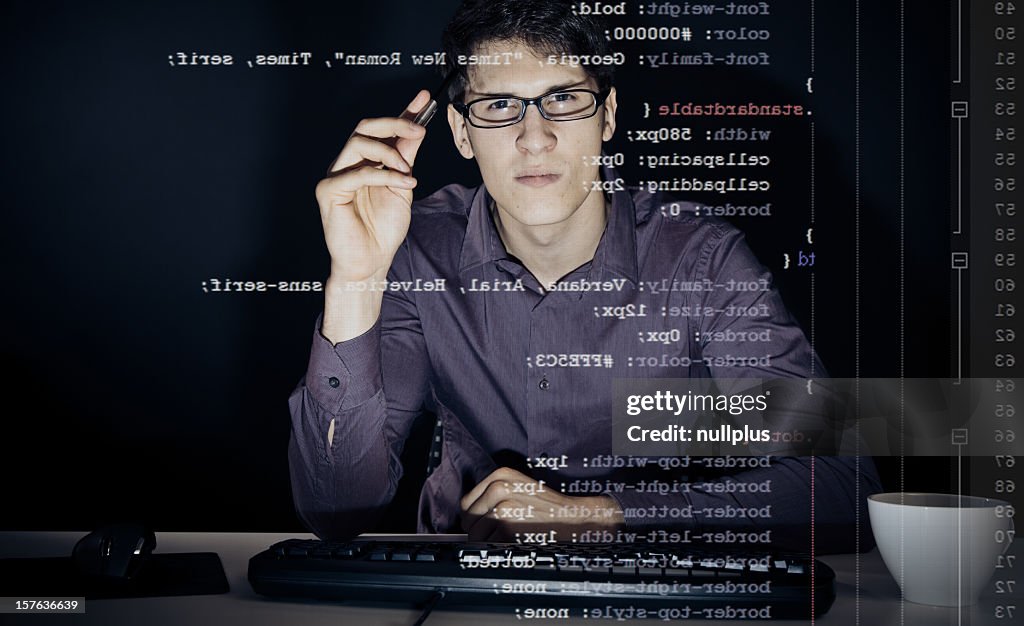 Young man analyzing his css definitions