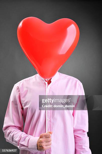 fall in love man has heart-shaped balloon instead of head - headless man 個照片及圖片檔