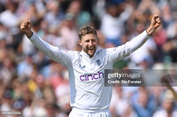 England bowler Joe Root celebrates after taking the wicket of Alex Carey during day two of the LV= Insurance Ashes 5th Test Match between England and...