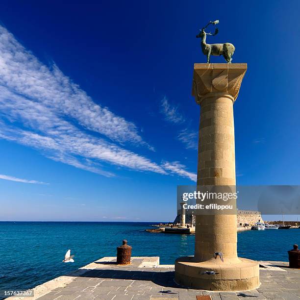 rhodes mandraki port entry - colossus stock pictures, royalty-free photos & images