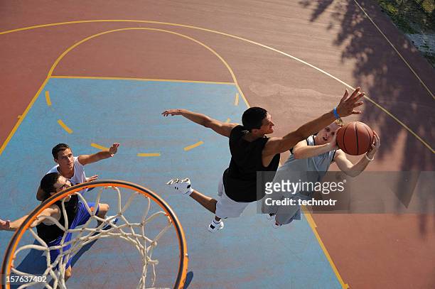 jump shot and block - basketball blocking shot stock pictures, royalty-free photos & images
