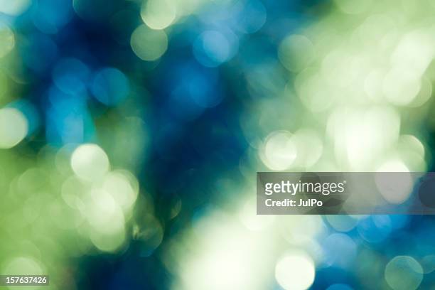 año nuevo bokeh - green blue background fotografías e imágenes de stock