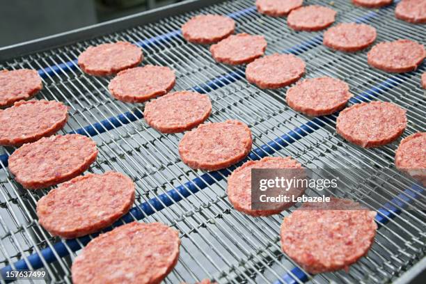 burgers on conveyor - meat production line stock pictures, royalty-free photos & images