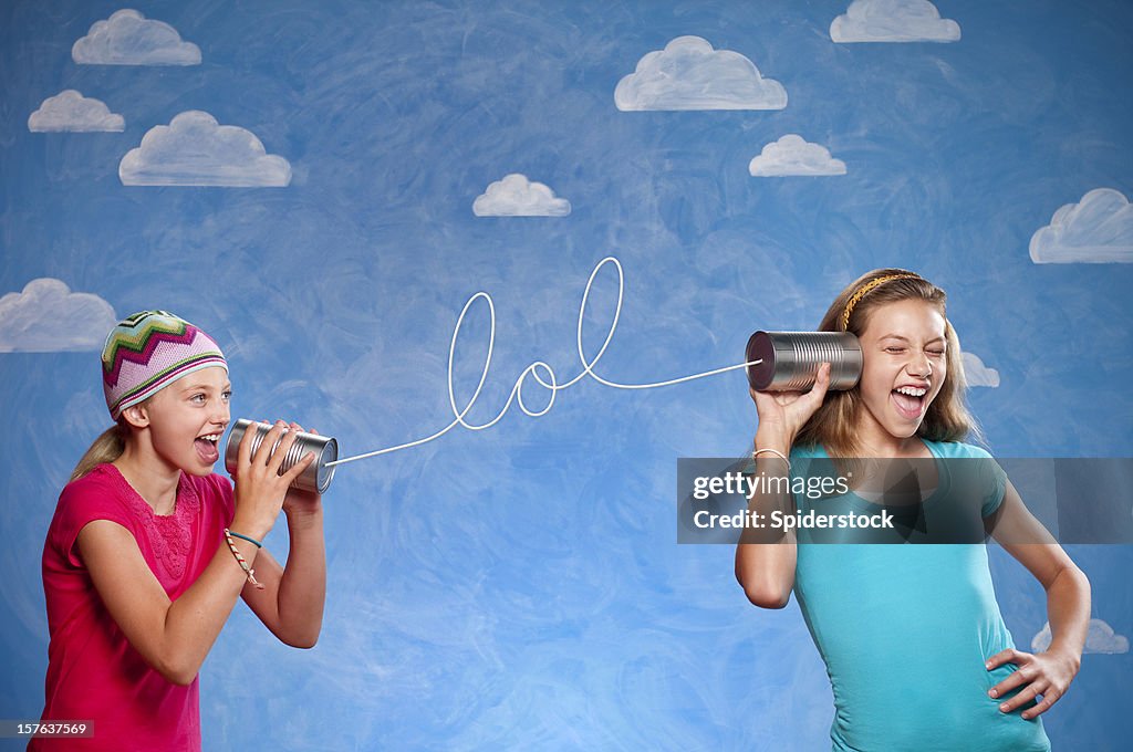 Girls With Tin Can Telephones