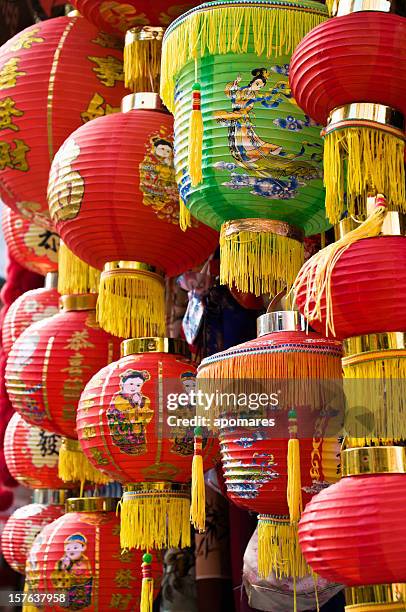 chinese paper lanterns hanging in a street martket - china lantern stock pictures, royalty-free photos & images