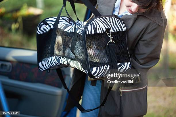 woman with pet carrier - pet carrier stock pictures, royalty-free photos & images