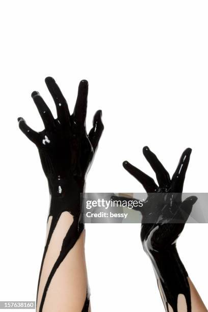 black hands - painted hands stock pictures, royalty-free photos & images