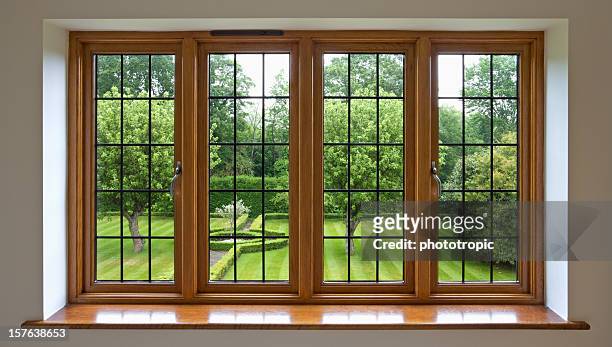 vista giardino con finestra in vetro piombato - window frame foto e immagini stock