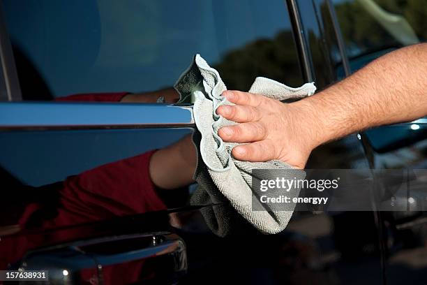 closeup of a black car being polished - polishing stock pictures, royalty-free photos & images