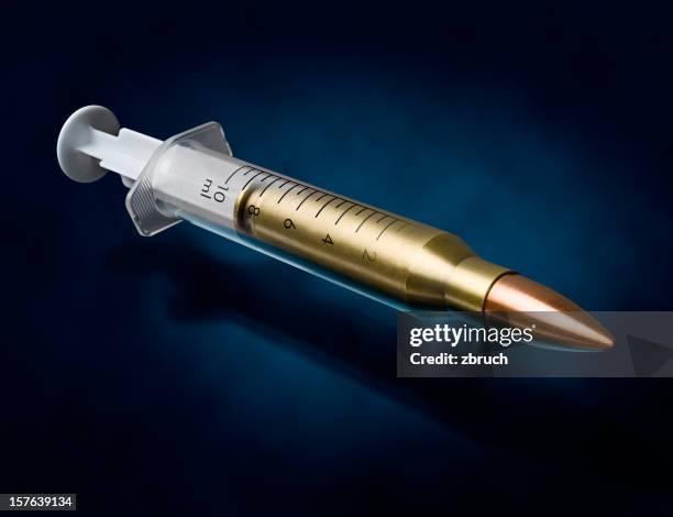 syringe-bullet - heroin addict arm stock pictures, royalty-free photos & images