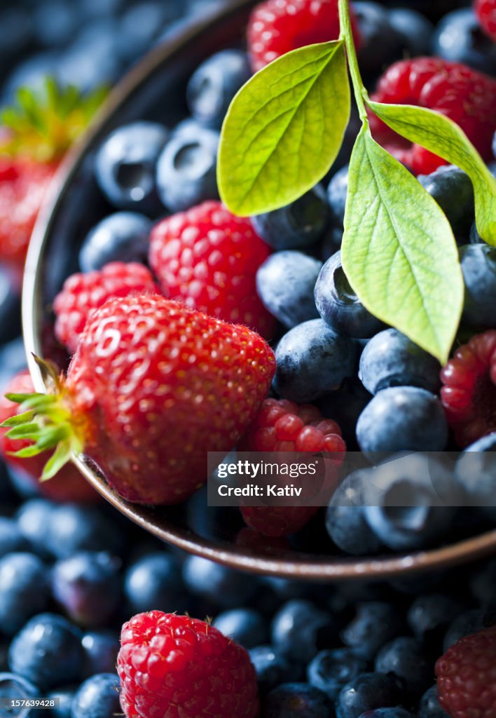 Selective focus of summer berries in bowl