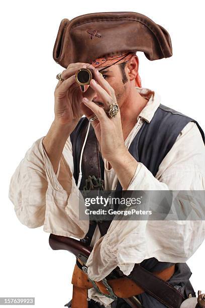 pirate exploring with spy glass - pirate criminal stock pictures, royalty-free photos & images