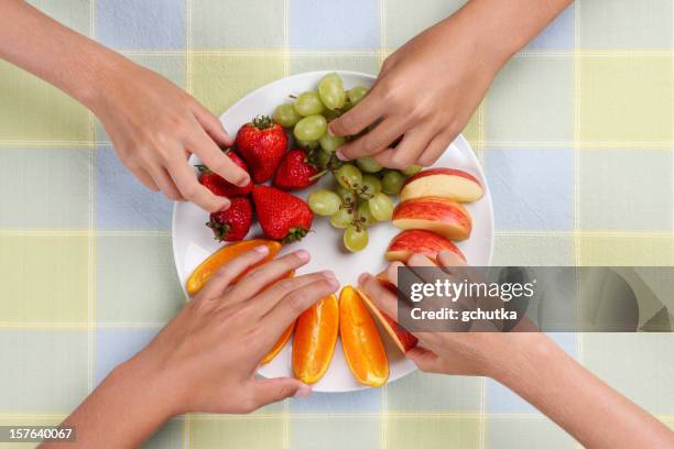 fruit snack plate - child reaching stock pictures, royalty-free photos & images