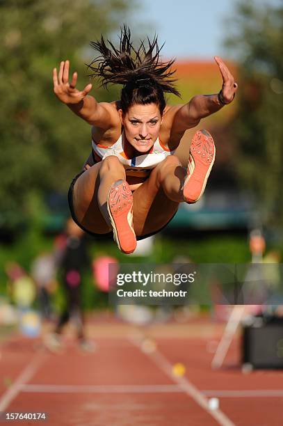 long jump - woman long jump stock-fotos und bilder