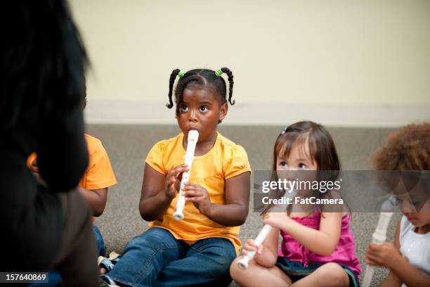 preschooler music class - recorder musical instrument stock pictures, royalty-free photos & images