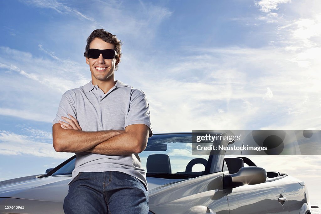 Man Sitting on Car