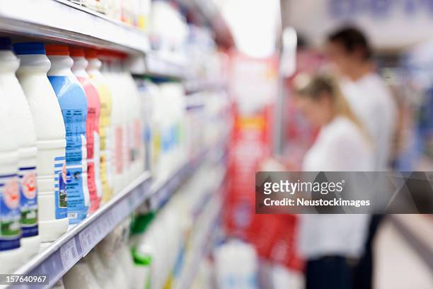 milk bottles on the shelves - dairy aisle stock pictures, royalty-free photos & images