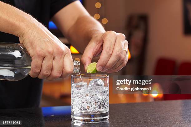 bartender - a vodka soda with lime stock pictures, royalty-free photos & images