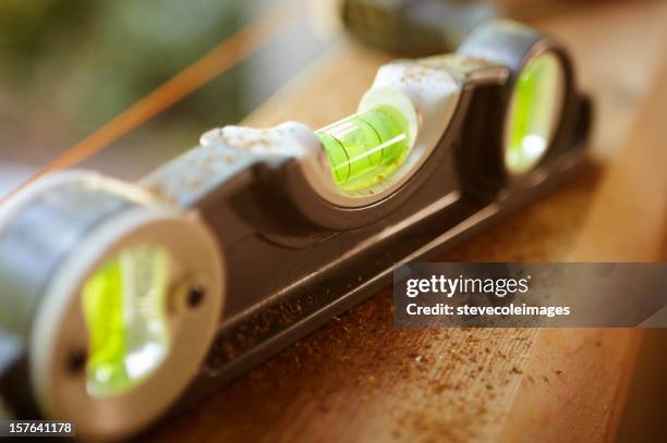 level sitting on a board - spirit level stock pictures, royalty-free photos & images